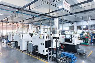 CNC lathe with automated loading and material alignment