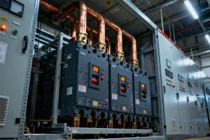 Large Air Circuit Breaker (ACB) installed as the main incomer protection unit within a high-current industrial switchboard panel.