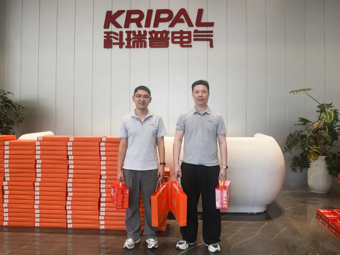KRIPAL Electric staff with Mid-Autumn Festival gift bags beside stacked gift boxes